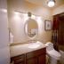 4 Seasons at Desert Breezes Palm Desert bathroom with vanity, sink, toilet and shower-tub combo
