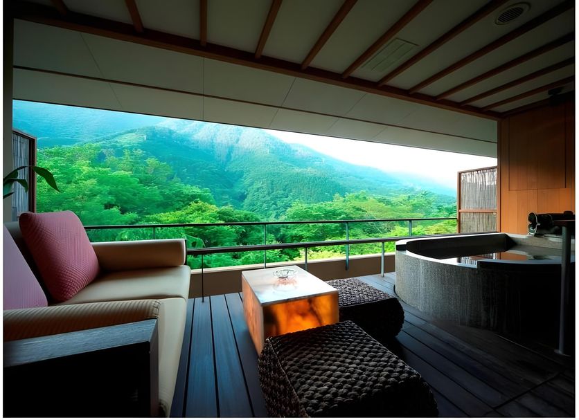 Hakone Ginyu in Hakone balcony suite with mountain and forest view, sofa, table and soaking tub