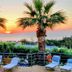 Oasis Scaleta Hotel in Skaleta with lounge chairs and sunset sea view