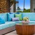 Hilton Garden Inn Kauai Wailua Bay in Kapaa: ocean-view patio seating with wicker sofa and coffee table