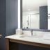Residence Inn by Marriott Doral Mall Area bathroom vanity with mirror, sink and shower in Doral