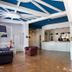 Bajamar Beach Hotel Formia lobby with blue-and-white ceiling, reception desk, and seating area