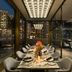 The Murray, Hong Kong, a Niccolo Hotel dining room with glass walls and city skyline views at night