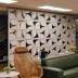 Strassen Hotel, Goiânia lobby with green sofa, brown lounge chairs and decorative wall art