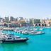 La Maison Ottomane in Chania with marina boats and turquoise harbor water