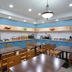 Country Inn & Suites by Radisson, Asheville West breakfast area with tables, chairs, and buffet counters