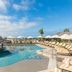 Solmar Resort Cabo San Lucas pool with swim-up bar, loungers and ocean view