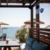 Cayo Exclusive Resort & Spa in Elounda with seaside terrace tables, umbrellas, and sea view