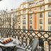 BLESS Hotel Madrid balcony with breakfast table and city street view in Madrid