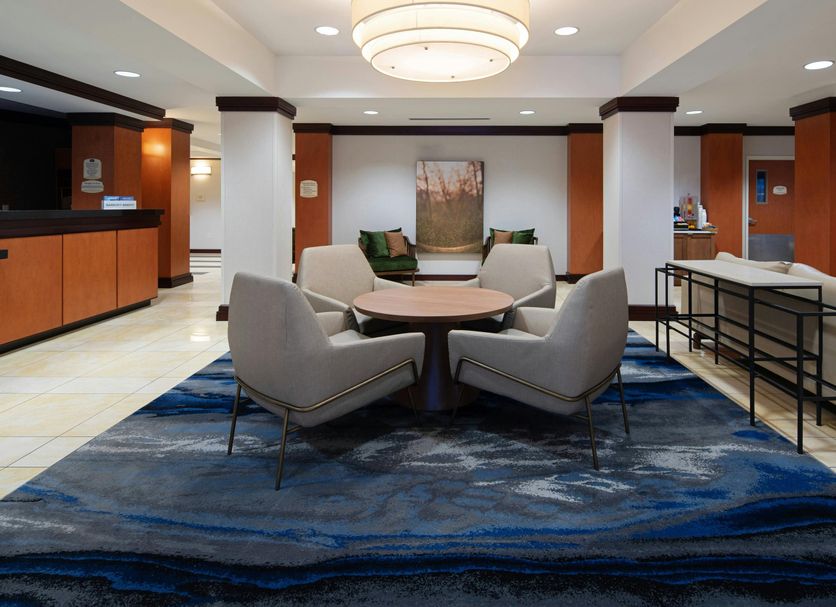Fairfield Inn & Suites by Marriott Seattle Bremerton lobby seating area with round table and blue rug in Bremerton