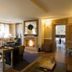 Meltar Boutique Hotel in Asiago lounge with fireplace, chandelier, and seating area