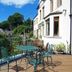 Bryn Melyn Apartments in Barmouth with outdoor terrace seating and garden views
