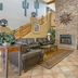 Best Western Gold Canyon Inn & Suites lobby with leather seating, stone fireplace and tiled floor