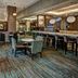 Residence Inn by Marriott Norfolk Downtown lobby lounge with bar, tables and chairs in Norfolk