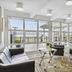 Hotel Pinenhus in Glyngøre lounge with large windows and sea view, black leather seating and glass tables
