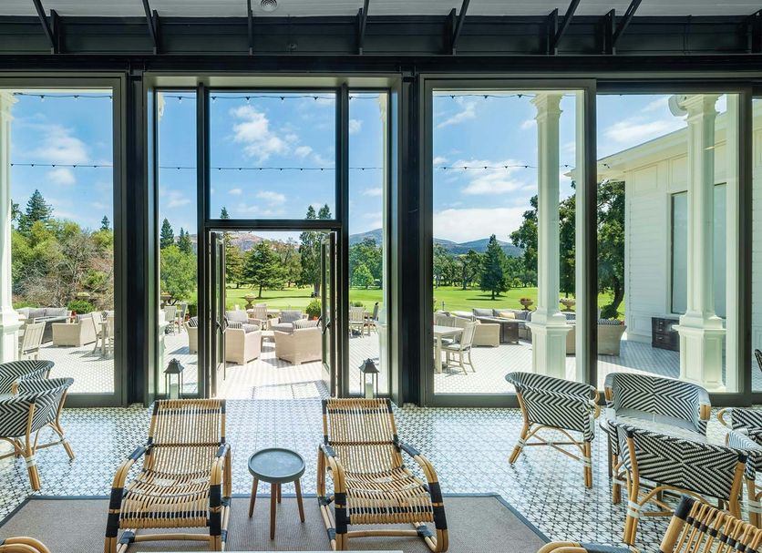 Silverado Resort in Napa with a bright glass-walled lounge opening to a scenic patio and gardens