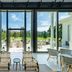 Silverado Resort in Napa with a bright glass-walled lounge opening to a scenic patio and gardens
