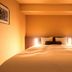 Richmond Hotel Naha Kumoji guest room with a neatly made bed and warm ambient lighting in Naha
