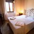 Agriturismo Il Casale Degli Amici in Norcia: cozy double room with wrought-iron bed and window