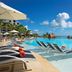Dreams Natura Resort & Spa in Puerto Morelos with a tropical infinity pool and ocean-view loungers