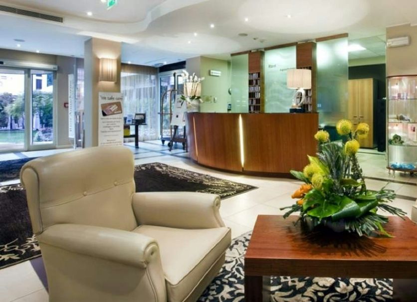 Rizzi Aquacharme Hotel & Spa lobby in Darfo Boario Terme with seating and front desk
