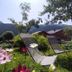 Chalet Appart'Hôtel l'Eau Vive in Saint-Nicolas-la-Chapelle with mountain-view garden chairs and flowers