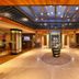 Tzl Suites Istanbul lobby with central floral display, polished floor, and warm illuminated seating areas