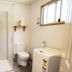 Mount Rumney Escapes - Platypus Cabin bathroom with shower, toilet and laundry sink in Cambridge