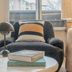 Yuna Porte-Maillot - Aparthotel room seating area with armchair, lamp, window and coffee table in Paris