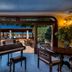 I Giardini di Cala Ginepro Hotel Resort lobby with piano and courtyard pool view in Cala Liberotto