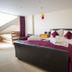 Atlantic Heights Luxury Guesthouse, St. Ives: guest room with double bed, purple bedding, and sloped ceiling