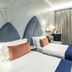 The Lift Boutique Hotel by Ridan Hotels in Lisbon: twin beds with blue runners and gold-accented headboards