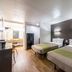 Studio 6-San Antonio, Tx - Fort Sam Houston Area room with two beds and wood flooring in San Antonio