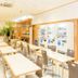 Toyoko Inn Okinawa Naha Asahibashi Ekimae breakfast area with tables and vending machines in Naha