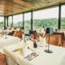 Gut Lauterbad Hotel in Freudenstadt dining room with large windows and forest views