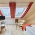 Arador City Hotel in Bad Oeynhausen guest room with skylight, desk, chair and twin beds
