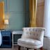Laston House, Ilfracombe: guest room with bed, blue bedside table, tufted chair and window