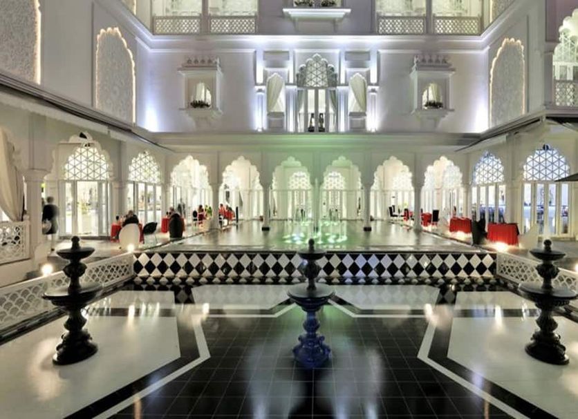 Chloe Gallery in Ho Chi Minh City: ornate indoor courtyard with central reflecting pool and arches
