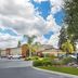 Best Western Porterville Inn in Porterville with landscaped entrance and blue sky