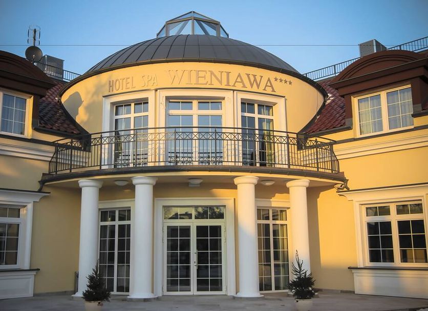Hotel Spa Wieniawa in Rekowo Górne with a domed entrance, balcony, and white columns