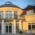 Hotel Spa Wieniawa in Rekowo Górne with a domed entrance, balcony, and white columns