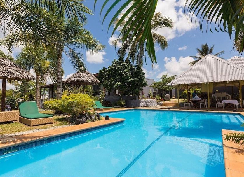 Coconut Palms Resort & Diamond Casino in Port Vila with tropical outdoor pool and palm trees