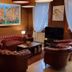 Lobby lounge at Unahotels Eco Hotel Villa Costanza Venezia in Venice with leather sofas and TV