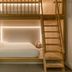 Zedwell Piccadilly Circus London bunk-style room with wooden loft bed and ladder