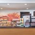 B&B Hotel Milano-Monza breakfast counter in Monza with pastries, bread, juice dispenser and coffee machine