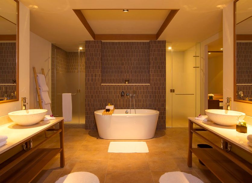 Silks Place Taroko Hotel bathroom in Xiulin Township with freestanding tub, dual sinks, and walk-in shower