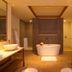 Silks Place Taroko Hotel bathroom in Xiulin Township with freestanding tub, dual sinks, and walk-in shower