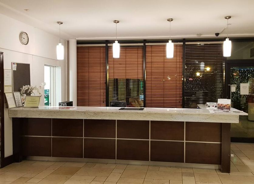 Ashbourne House Hotel in Ashbourne reception desk with pendant lights and wood blinds