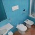 Flegrea House - Casa Rosa bathroom in Pozzuoli with bidet, toilet and bathtub