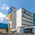 Baymont by Wyndham Laredo exterior with multi-story facade, blue entrance canopy and parking lot